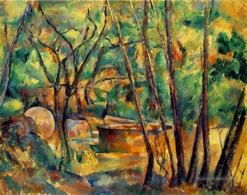 Meule et Citerne sous les arbres Paul Cézanne Peinture à l'huile